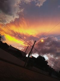 Low angle view of silhouette trees against sky during sunset