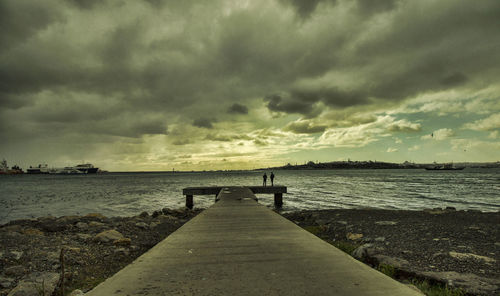 Scenic view of pier over sea against sky