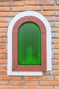 Close-up of window on brick wall