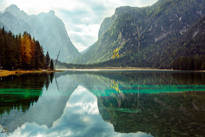 Scenic view of lake and mountains against sky