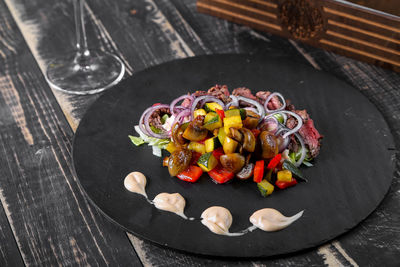 High angle view of fruits in plate on table