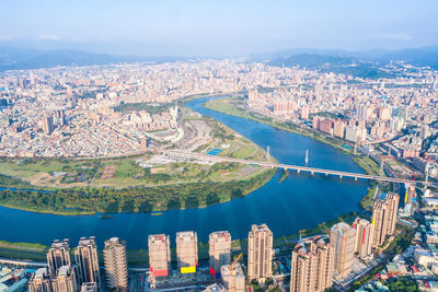 High angle view of river amidst buildings in city