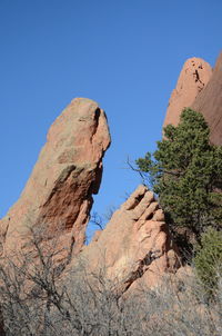 Low angle view of rock formation against sky