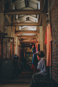 Rear view of man and woman hanging on ceiling