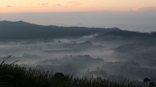 Scenic view of mountains against sky during sunset