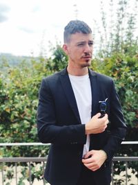 Young man standing outdoors