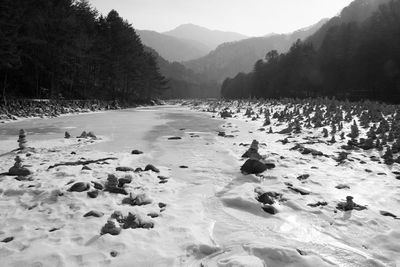 Scenic view of landscape against sky during winter