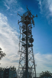 Low angle view of communications tower against sky