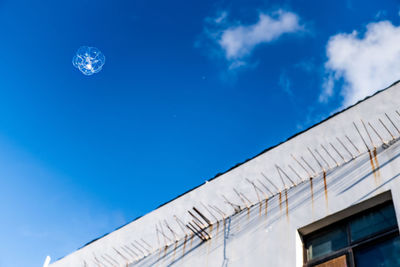 Low angle view of building against blue sky