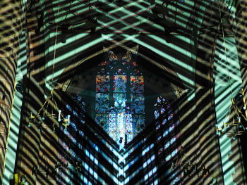 Low angle view of illuminated chandelier in building