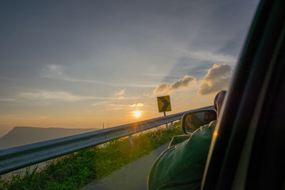 Scenic view of agricultural field against sky during sunset