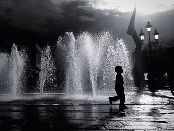 Woman enjoying fountain