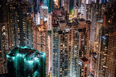 Aerial view of city lit up at night