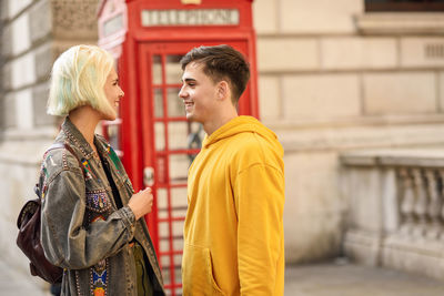 Smiling couple standing in city