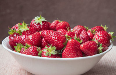 Close-up of strawberries in bowl on table