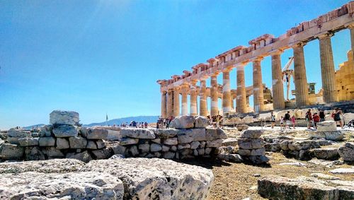 View of old ruins against clear blue sky