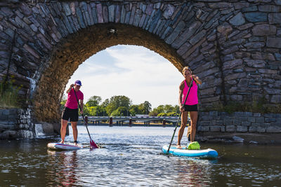 Couple paddle boarding