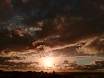 Scenic view of dramatic sky during sunset