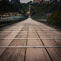 Man walking on footbridge