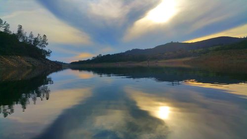Scenic view of lake at sunset