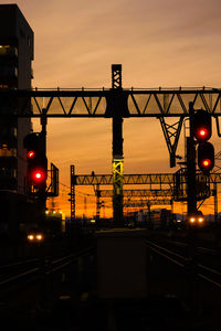 Illuminated bridge against sky at night