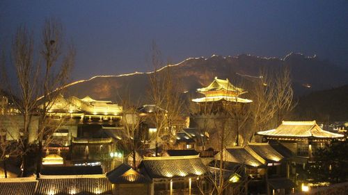 Illuminated buildings in city at night