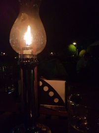 Lit lamp at night