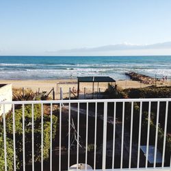 Scenic view of sea against blue sky