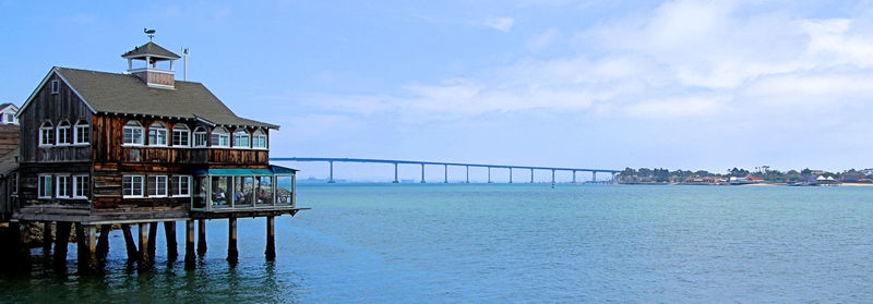 Seafood restaurant on the bay.  coronado bridge in he background.