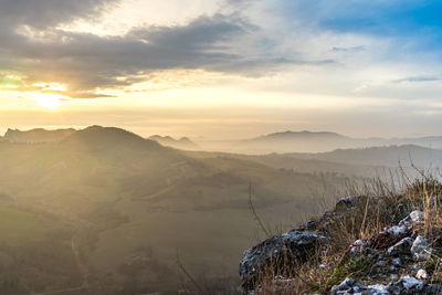 Scenic view of mountains against sky during sunset