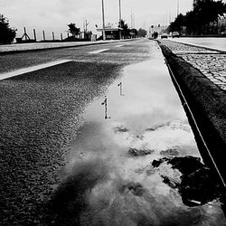 Empty road in city at dusk