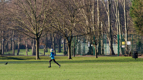 Full length of man skateboarding in park