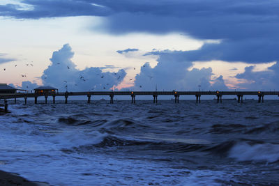 Pier over sea against sky