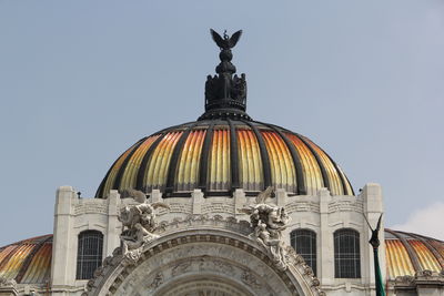 Low angle view of statue against building