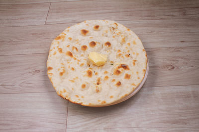 High angle view of bread on wooden table