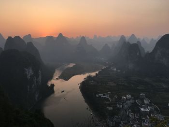 Aerial view of buildings at sunset