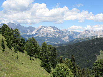 Scenic view of mountains against cloudy sky