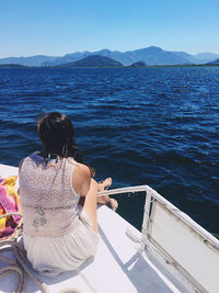 Rear view of woman looking at sea