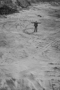 High angle view of man on snowy field