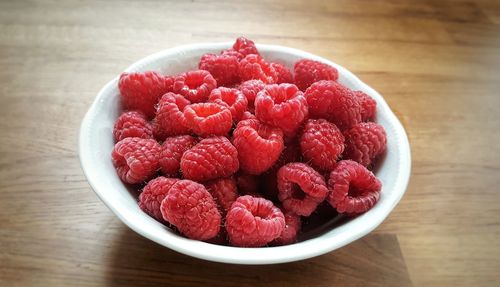 High angle view of strawberries in bowl on table