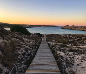 Scenic view of sea against clear sky during sunset