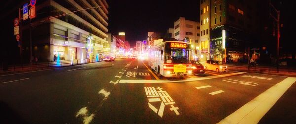 Illuminated road in city at night