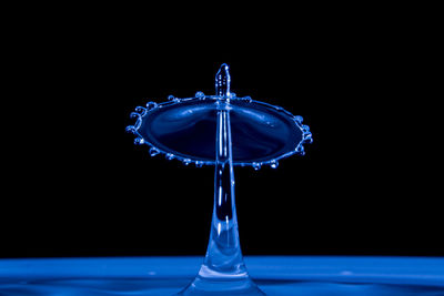 Close-up of water splashing against black background