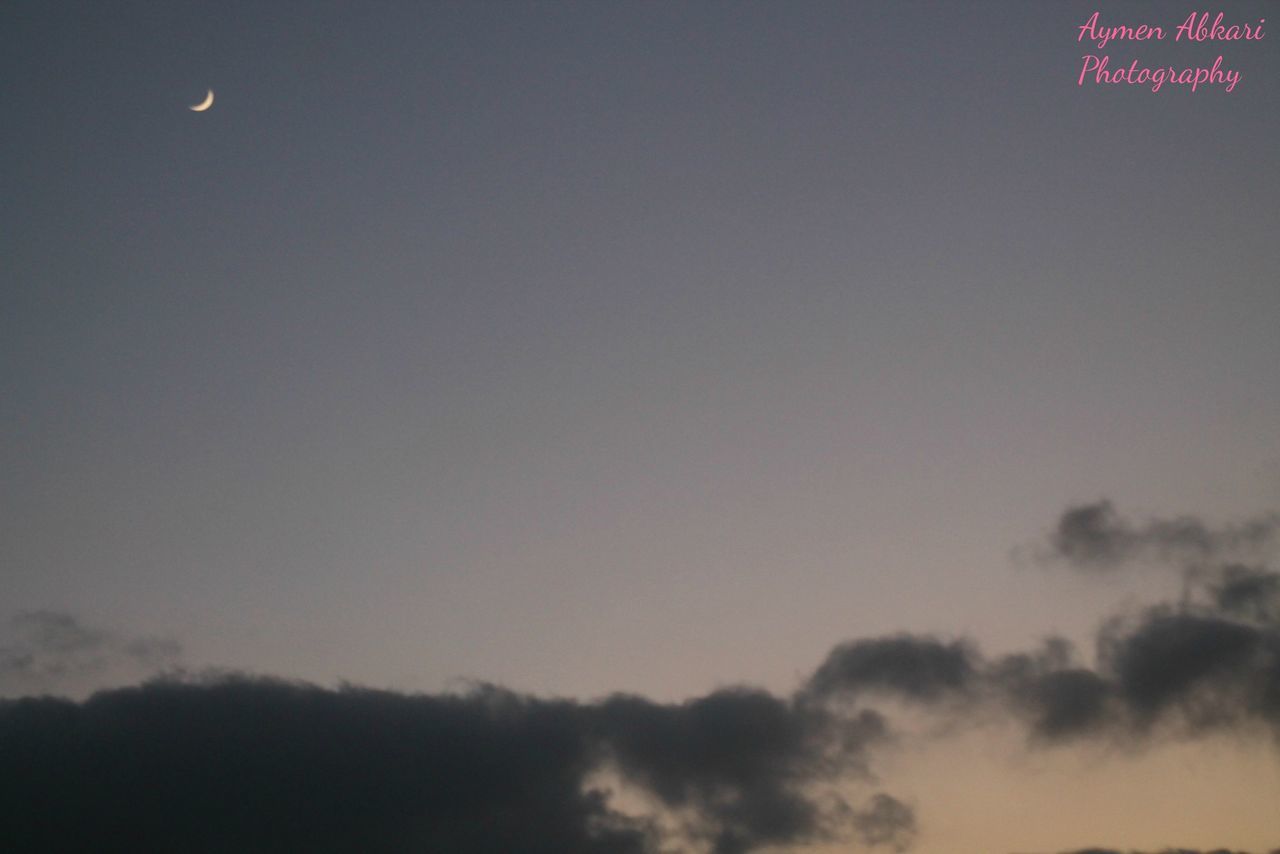 low angle view, moon, sky, scenics, beauty in nature, tranquility, tranquil scene, nature, copy space, night, sky only, idyllic, dusk, cloud - sky, outdoors, full moon, no people, majestic, high section, silhouette