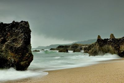 Scenic view of beach against sky