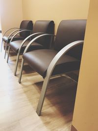 Close-up of chairs on table