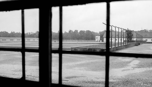 Scenic view of river against sky seen through window