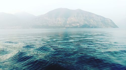 Scenic view of sea against mountains