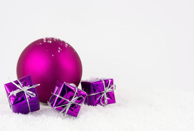 Close-up of christmas decorations over white background