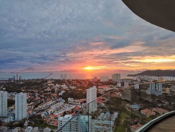 High angle view of buildings against sky during sunset